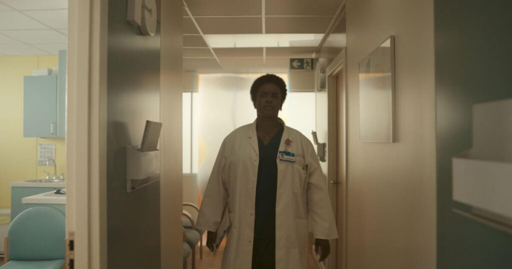 Wunmi Mosaku as Dr. Willis (aka Hunter B-15) in Marvel Studios' LOKI, Season 2, episode 5. She is wearing a white lab coat with a puzzled expression on her face.