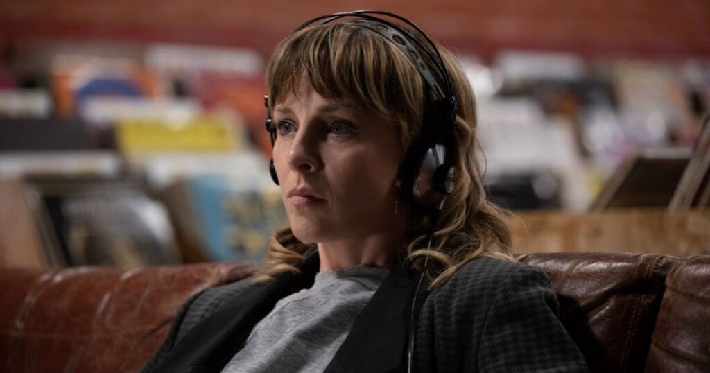 Photo still of Sophia Di Martino as Sylvie in Marvel Studios' LOKI, Season 2, episode 5, listening to Oh Sweet Nuthin' by The Velvet Underground in a record store.