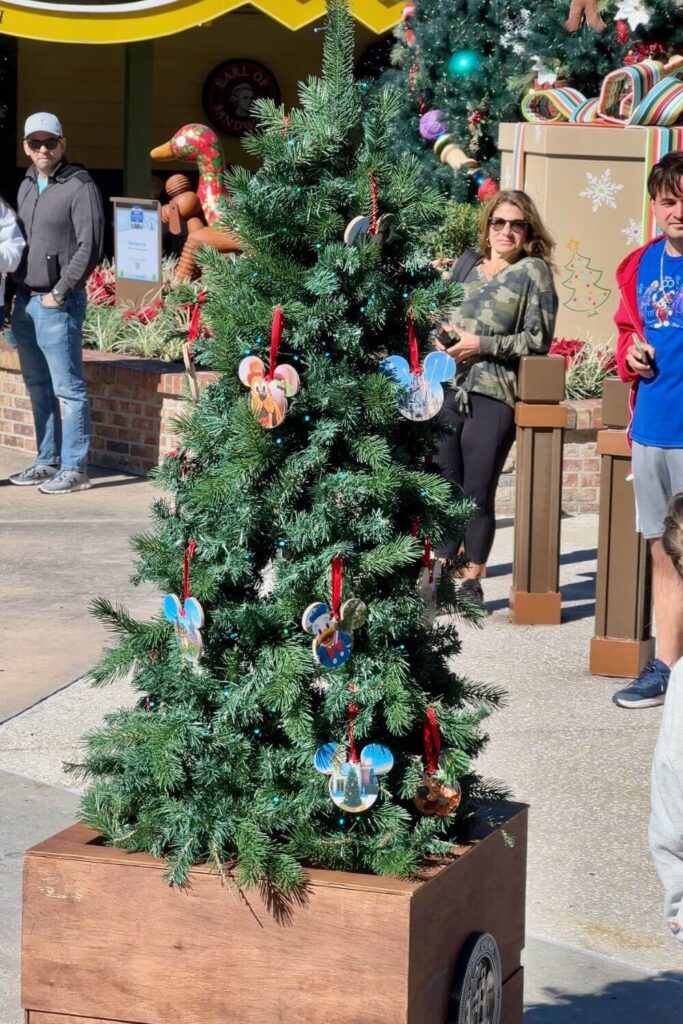 Closeup of Douglas Fir, the talking mini Christmas tree that rolls around Disney Springs entertaining guests.