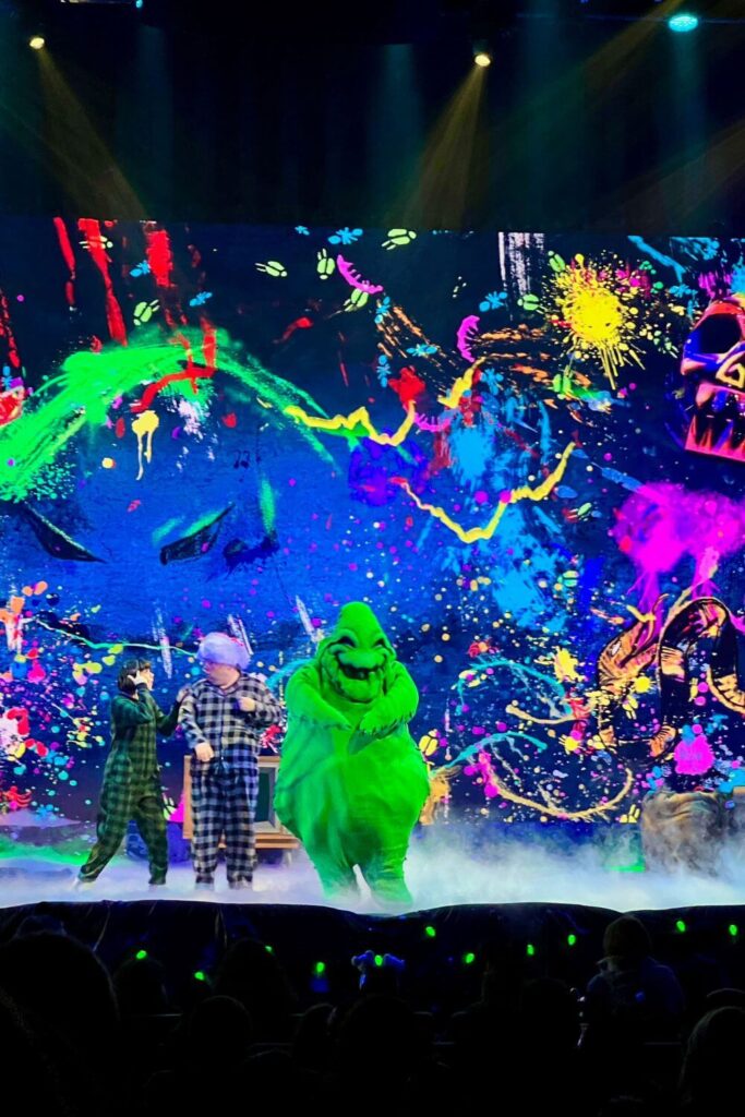 Photo of Oogie Boogie and the hosts of the Nightmare Before Christmas sing-along show at Jollywood Nights.