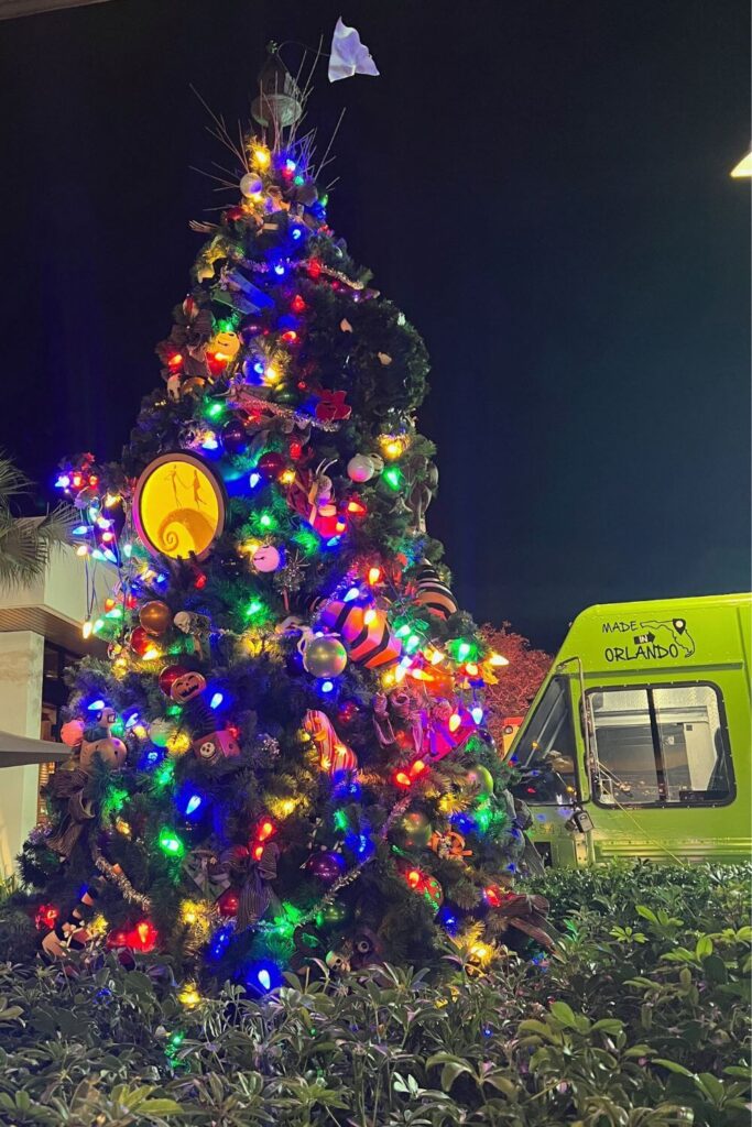 Photo of the Nightmare Before Christmas tree at night in the Disney Springs food truck park.