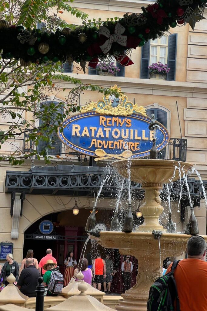 Photo of the entrance to Remy's Ratatouille Adventure ride at Disney World's Epcot, with a sign for the single rider line entrance visible.